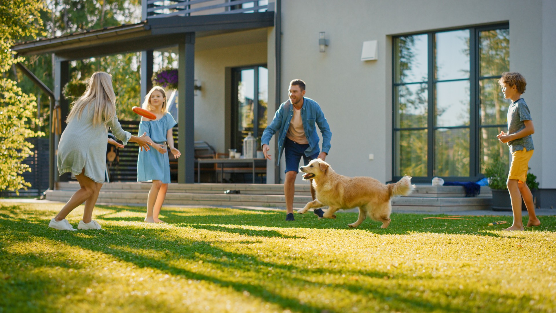 Family playing in their backyard